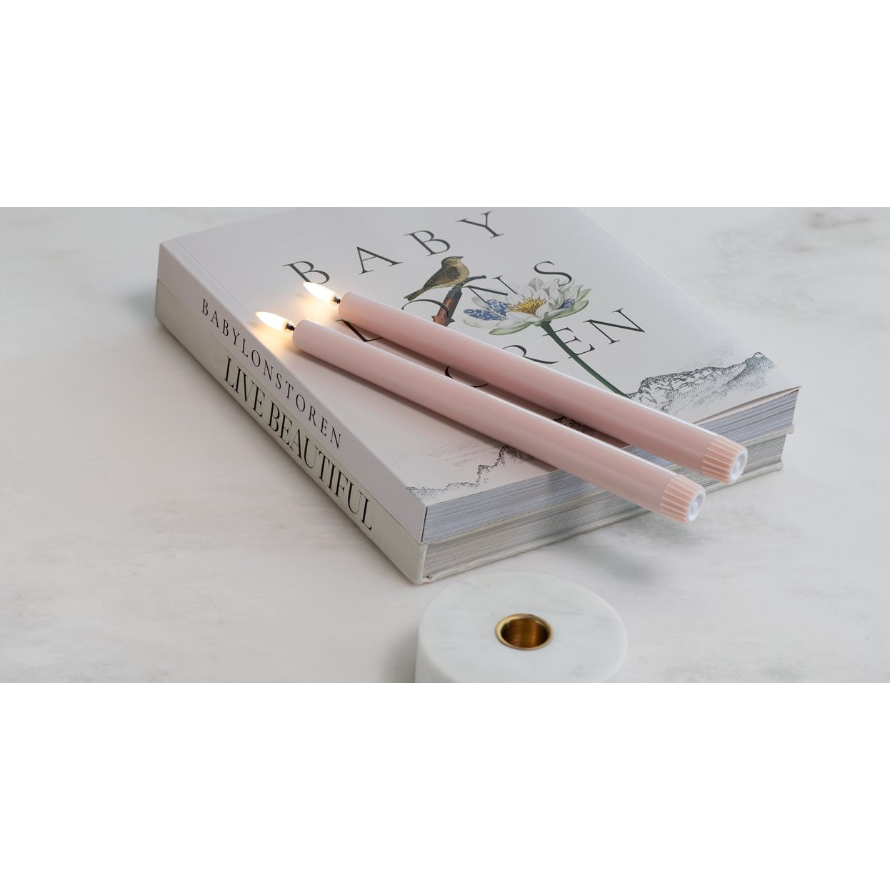 pink candles, pink candle, lit candle, book, dekorative kerze